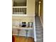 Charming kitchen with stainless steel appliances, breakfast bar with seating, and stairs to the loft bedroom at 4899 S Dudley St # K18, Littleton, CO 80123