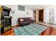 Fun basement game room featuring an Atari machine, sauna, sofa with colorful pillows, and a unique rug at 159 Lake Rd, Idaho Springs, CO 80452