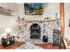 Living area with a stone fireplace as the focal point, with a decorative mantle at 159 Lake Rd, Idaho Springs, CO 80452