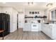 Bright kitchen with shaker cabinets, subway tile backsplash, and stainless-steel appliances with wood-style flooring at 159 Lake Rd, Idaho Springs, CO 80452