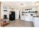 Bright kitchen with shaker cabinets, subway tile backsplash, and stainless-steel appliances with wood-style flooring at 159 Lake Rd, Idaho Springs, CO 80452