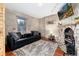 Relaxing living room with a stone fireplace, wooden floors, and modern furniture at 159 Lake Rd, Idaho Springs, CO 80452