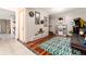 Spacious living room with hardwood floors, unique mirrors, a cool area rug, and nice natural light at 159 Lake Rd, Idaho Springs, CO 80452