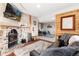 Inviting living room with stone fireplace and wood accents, offering a cozy and rustic atmosphere at 159 Lake Rd, Idaho Springs, CO 80452