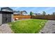This spacious backyard features lush green grass, a fence, and fresh landscaping at 27893 E 6Th Pl, Aurora, CO 80018