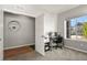 Well-lit bedroom with a workspace and a window providing natural light at 27893 E 6Th Pl, Aurora, CO 80018