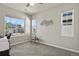 Bright bedroom featuring ample natural light and views of the neighborhood at 27893 E 6Th Pl, Aurora, CO 80018