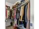 This well-organized walk-in closet features ample hanging space and shelving for optimal storage solutions at 27893 E 6Th Pl, Aurora, CO 80018
