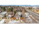 Aerial view of home featuring a two-car garage, snowy roof, and mountain views at 8799 Independence Way, Arvada, CO 80005