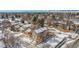 Aerial view of home with fenced yard and snow-covered lawn in a residential neighborhood at 8799 Independence Way, Arvada, CO 80005