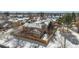 Aerial view of home featuring a fenced yard, roof, and brick chimney at 8799 Independence Way, Arvada, CO 80005