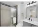 Modern bathroom with a glass-enclosed shower, sleek vanity, and contemporary fixtures at 8799 Independence Way, Arvada, CO 80005