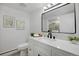 A sleek bathroom featuring modern fixtures, ample counter space, and stylish décor at 8799 Independence Way, Arvada, CO 80005