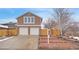 Charming two-story home with a well-maintained yard and a two-car garage at 8799 Independence Way, Arvada, CO 80005