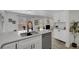 Stylish kitchen featuring stainless steel appliances, a quartz countertop, and a modern faucet at 8799 Independence Way, Arvada, CO 80005