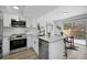 Modern kitchen with stainless steel appliances, quartz countertops, and ample cabinet space at 8799 Independence Way, Arvada, CO 80005