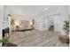 Bright living room with hardwood floors, a fireplace, and a neutral color palette at 8799 Independence Way, Arvada, CO 80005