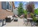 Charming back patio with comfortable seating, lanterns, and stylish decor for outdoor relaxation at 10258 Pennington Ln, Highlands Ranch, CO 80126