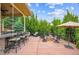 Large outdoor patio with built-in grill, bar, fire pit, and ample seating perfect for entertaining at 10258 Pennington Ln, Highlands Ranch, CO 80126