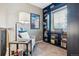 Cozy sitting area with built-in shelves, a window, chair, throw pillow and a lamp at 10258 Pennington Ln, Highlands Ranch, CO 80126