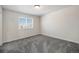 Bright and inviting bedroom with gray carpet and a sunlit window at 1732 Aspen Meadows Cir, Federal Heights, CO 80260