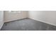 Neutral bedroom featuring gray carpet, white baseboards, and outlets at 1732 Aspen Meadows Cir, Federal Heights, CO 80260