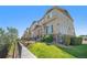 Well-maintained townhome complex with manicured landscaping and a sidewalk, showcasing a desirable neighborhood at 1732 Aspen Meadows Cir, Federal Heights, CO 80260