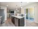 Stylish kitchen with a breakfast bar overlooking the living room, stainless appliances, and sliding glass doors at 1732 Aspen Meadows Cir, Federal Heights, CO 80260