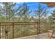 Balcony overlooking mature trees, offering a private outdoor retreat with scenic views at 2700 E Cherry Creek South Dr # 220, Denver, CO 80209