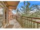 Balcony with seating area overlooking trees, a perfect spot for relaxation and enjoying nature at 2700 E Cherry Creek South Dr # 220, Denver, CO 80209