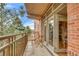 Relaxing balcony area with brick accents and natural light, perfect for outdoor enjoyment at 2700 E Cherry Creek South Dr # 220, Denver, CO 80209