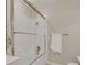 Clean bathroom featuring a bathtub with glass doors at 2700 E Cherry Creek South Dr # 220, Denver, CO 80209