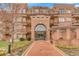 Elegant brick apartment building featuring a grand entrance with a beautifully designed entryway at 2700 E Cherry Creek South Dr # 220, Denver, CO 80209