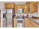 Modern kitchen with stainless steel appliances, ample storage, and a functional layout at 2700 E Cherry Creek South Dr # 220, Denver, CO 80209