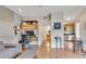 Open-concept living area with a work space and adjacent kitchen, promoting a seamless flow at 2700 E Cherry Creek South Dr # 220, Denver, CO 80209