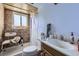 Practical bathroom with a toilet, sink, and shower featuring accessibility enhancements for safety at 10932 W 107Th Ave, Broomfield, CO 80021
