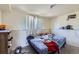 Bedroom featuring a comfortable bed and a window offering natural light and outdoor views at 10932 W 107Th Ave, Broomfield, CO 80021
