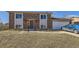 Charming two-story brick home featuring an attached garage and a well-maintained lawn at 10932 W 107Th Ave, Broomfield, CO 80021