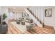 Well-lit finished basement featuring luxury vinyl flooring and a staircase with white painted risers at 1325 Lima St, Aurora, CO 80010