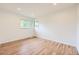Bright bedroom featuring hardwood floors, recessed lighting, and a double-pane window at 1325 Lima St, Aurora, CO 80010