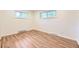 Bright bedroom featuring hardwood floors, and a large double-pane window at 1325 Lima St, Aurora, CO 80010