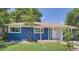 Charming blue single-story home with well-maintained lawn and covered porch, perfect for enjoying the outdoors at 1325 Lima St, Aurora, CO 80010
