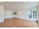 Bright living room with hardwood floors and ample natural light, creating a warm and inviting atmosphere at 1325 Lima St, Aurora, CO 80010