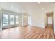 Sunlit living room with hardwood floors, open layout, and a bright, inviting atmosphere at 1325 Lima St, Aurora, CO 80010
