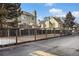 Townhomes with fenced in yards located next to paved parking lot and near a playground at 1885 S Quebec Way # C15, Denver, CO 80231