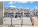 Townhome building exterior featuring balconies and a fenced-in pool area, perfect for relaxation and entertainment at 1885 S Quebec Way # C15, Denver, CO 80231