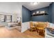 Bright dining area with hardwood floors, wooden table, and views into the living room at 1885 S Quebec Way # C15, Denver, CO 80231