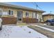 Modest brick building exterior with visible parking and a practical, functional design at 3420 Tennyson St # 105, Denver, CO 80212