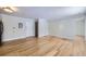 Bright living room featuring sleek hardwood floors and modern lighting fixtures at 3420 Tennyson St # 105, Denver, CO 80212