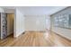 Bright living room featuring sleek hardwood floors, neutral paint, and modern fixtures at 3420 Tennyson St # 105, Denver, CO 80212